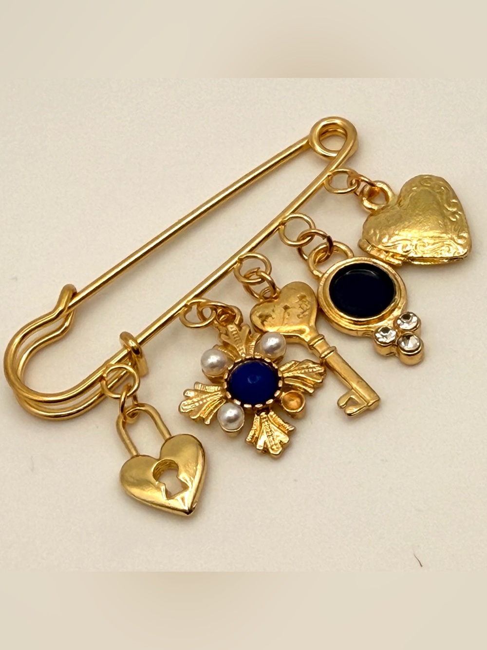 Gold Charm Safety Pin Brooch with Blue Black Accents and Pearl